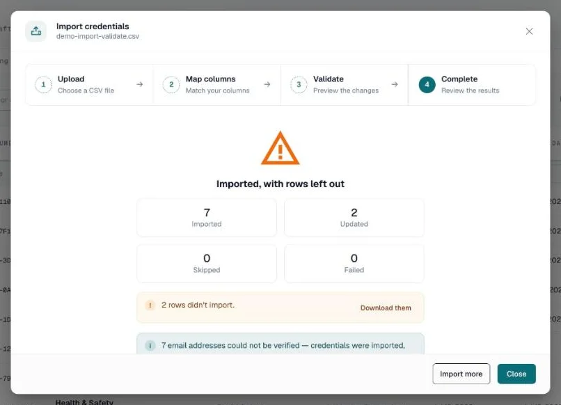 Import complete screen with counts and a Download them link for the rows left out